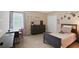 bedroom featuring a twin bed, dresser, desk, closet, and fun wall decorations at 161 Overlook Cir, Canton, GA 30115