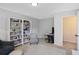 Comfortable bedroom with bookcases, chair, and adjacent study desk at 161 Overlook Cir, Canton, GA 30115