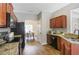Well-equipped kitchen with granite countertops, stainless steel appliances, and stylish wood-look flooring at 161 Overlook Cir, Canton, GA 30115