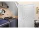 Convenient laundry room featuring modern washer and dryer units and extra storage shelves at 161 Overlook Cir, Canton, GA 30115
