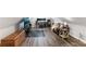 Attic living space with wood floors, sofa, desk and TV. Ideal game room or home office at 161 Overlook Cir, Canton, GA 30115