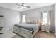 Inviting main bedroom featuring a comfortable queen-sized bed, neutral decor, and ample natural light at 161 Overlook Cir, Canton, GA 30115