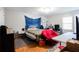 Bedroom features natural light, wood flooring, comfortable furnishings and plenty of storage at 2620 Clairmont Rd, Atlanta, GA 30329
