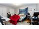 A bedroom with wood floors, bright light, study area and comfortable furnishings at 2620 Clairmont Rd, Atlanta, GA 30329