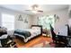 Functional bedroom with natural light, wood floors, plants and study area at 2620 Clairmont Rd, Atlanta, GA 30329