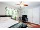 Functional bedroom with natural light, wood floors, plants and study area at 2620 Clairmont Rd, Atlanta, GA 30329