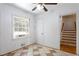Dining area features tile flooring, large window and doorway that leads to stairs at 2620 Clairmont Rd, Atlanta, GA 30329