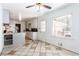 Bright kitchen features tile floors, white cabinets, and a view to the outside at 2620 Clairmont Rd, Atlanta, GA 30329