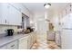 Functional kitchen featuring ample cabinet space, appliances, and checkered flooring at 2620 Clairmont Rd, Atlanta, GA 30329