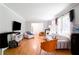 Bright living room features hardwood floors, large windows and updated furniture at 2620 Clairmont Rd, Atlanta, GA 30329