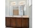 Bathroom featuring double vanity with dark wood cabinets and tile floor at 3066 Quantum Ln # 24, Atlanta, GA 30341
