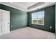 Bedroom with a large window, tray ceiling and neutral decor at 3066 Quantum Ln # 24, Atlanta, GA 30341