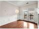 Dining area featuring hardwood floors, stylish light fixture, wainscoting and a patio door at 3066 Quantum Ln # 24, Atlanta, GA 30341