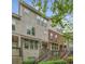 Townhome exterior featuring a mix of stone and brick facade, stairs lead to covered entrance at 3066 Quantum Ln # 24, Atlanta, GA 30341