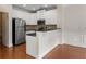 Well-lit kitchen with white cabinets, stainless steel appliances, and granite countertops at 3066 Quantum Ln # 24, Atlanta, GA 30341