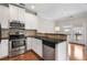 Kitchen featuring stainless steel appliances, granite countertops, and access to balcony at 3066 Quantum Ln # 24, Atlanta, GA 30341