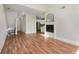 Spacious living area with hardwood floors, a fireplace, and an open layout to the kitchen at 3066 Quantum Ln # 24, Atlanta, GA 30341