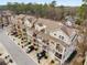 View of townhomes with attached garages and small balconies overlooking the front at 3066 Quantum Ln # 24, Atlanta, GA 30341