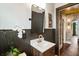 Elegant bathroom with marble countertop, and dark wood paneling at 978 Eden Se Ave, Atlanta, GA 30316