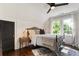 Cozy bedroom with ceiling fan, hardwood floors, and natural light at 978 Eden Se Ave, Atlanta, GA 30316