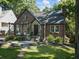 Brick home with a stone accent entry, pretty landscaping, and a pergola covered porch seating area at 978 Eden Se Ave, Atlanta, GA 30316
