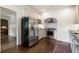 Kitchen featuring white cabinets, stainless steel appliances, and wood floors at 978 Eden Se Ave, Atlanta, GA 30316