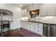 Kitchen featuring white cabinets, stainless steel appliances, and dark countertops at 978 Eden Se Ave, Atlanta, GA 30316