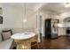 Bright breakfast nook with a white table, built in bench and hardwood flooring at 978 Eden Se Ave, Atlanta, GA 30316