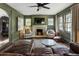 Living room featuring a fireplace, green walls, and leather seating at 978 Eden Se Ave, Atlanta, GA 30316
