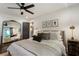 Bright main bedroom featuring a large mirror, bed, and ceiling fan at 978 Eden Se Ave, Atlanta, GA 30316