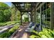 Charming patio with brick floor, comfortable chairs, and lush greenery surrounding the outdoor space at 978 Eden Se Ave, Atlanta, GA 30316