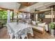 The screened porch features both a comfortable seating area and a dining table for entertainment at 978 Eden Se Ave, Atlanta, GA 30316