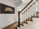 Classic staircase with wooden treads and white painted risers at 978 Eden Se Ave, Atlanta, GA 30316