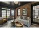 Bright sunroom featuring brick accents, a dark ceiling, and multiple windows that provide abundant natural light at 978 Eden Se Ave, Atlanta, GA 30316