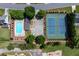 Overhead shot of a community pool and tennis courts with ample green space and parking at 11569 Finley St, Suwanee, GA 30024