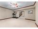 Spacious basement area with carpeting, a treadmill, and a staircase at 11569 Finley St, Suwanee, GA 30024