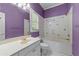 Bathroom features a vanity with sink and combination tub/shower at 11569 Finley St, Suwanee, GA 30024
