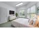 Inviting bedroom with plenty of natural light, a modern dresser, and serene decor at 11569 Finley St, Suwanee, GA 30024