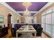Formal dining room with a stylish chandelier, mirrored wall, and elegant decor for memorable gatherings at 11569 Finley St, Suwanee, GA 30024