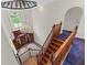 Foyer features a staircase, a chandelier, and stone floors at 11569 Finley St, Suwanee, GA 30024