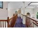 Hallway with carpet, crown molding, and view of a living space at 11569 Finley St, Suwanee, GA 30024