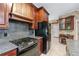 Chef's kitchen with stainless appliances, granite countertops, and custom cabinets at 11569 Finley St, Suwanee, GA 30024