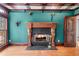 Living room with fireplace, hardwood floors, and views of the outside at 11569 Finley St, Suwanee, GA 30024
