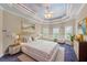 Main bedroom featuring trey ceiling, soft natural light, and bedside table at 11569 Finley St, Suwanee, GA 30024