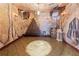 Unique wine cellar with custom rack, barrel, and textured walls at 11569 Finley St, Suwanee, GA 30024