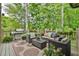 A cozy outdoor deck with comfortable seating and a stainless steel grill at 2111 Broadfield Run, Duluth, GA 30097
