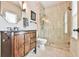 Bathroom with updated vanity, glass enclosed shower, and natural light at 2111 Broadfield Run, Duluth, GA 30097