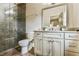 Bathroom featuring a walk-in glass shower, granite countertop, and neutral color palette at 2111 Broadfield Run, Duluth, GA 30097