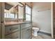 Bathroom featuring a granite countertop, gray cabinets, mirror, and neutral color palette at 2111 Broadfield Run, Duluth, GA 30097