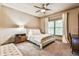 Cozy bedroom features carpet, a ceiling fan, and natural light at 2111 Broadfield Run, Duluth, GA 30097